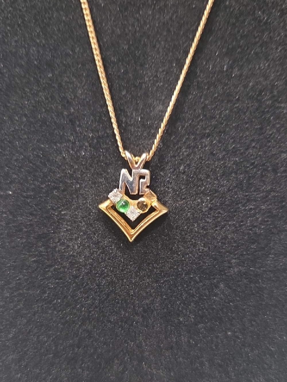 Nina Ricci Two-Tone Pendant Necklace with Green Accent